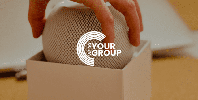 WeDoYourGroup white logo on background of device being taken out of a white box