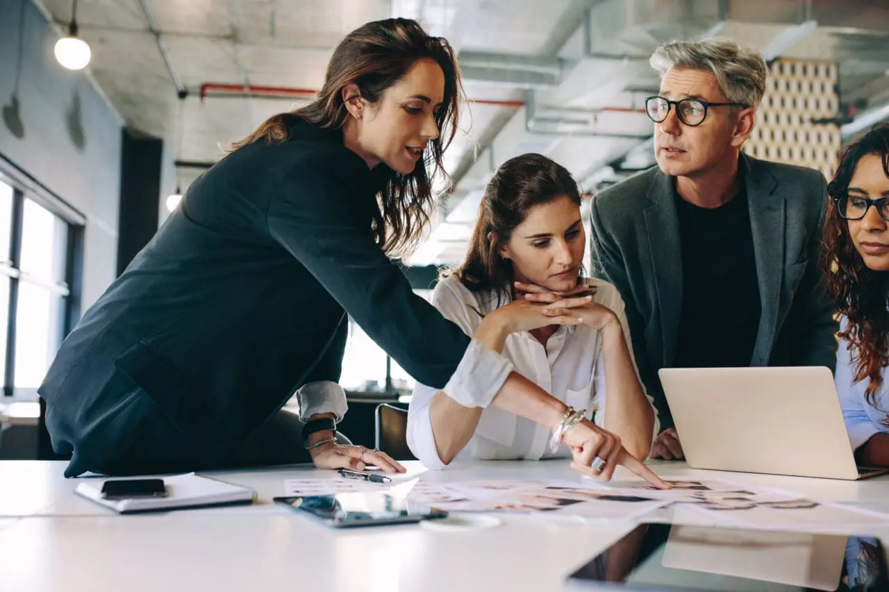 Business people discussing over new advertising project in project