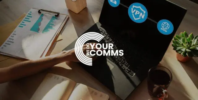 WeDoYourComms white logo on background of woman typing on laptop, on desk with open notebook. VPN logo on the computer screen