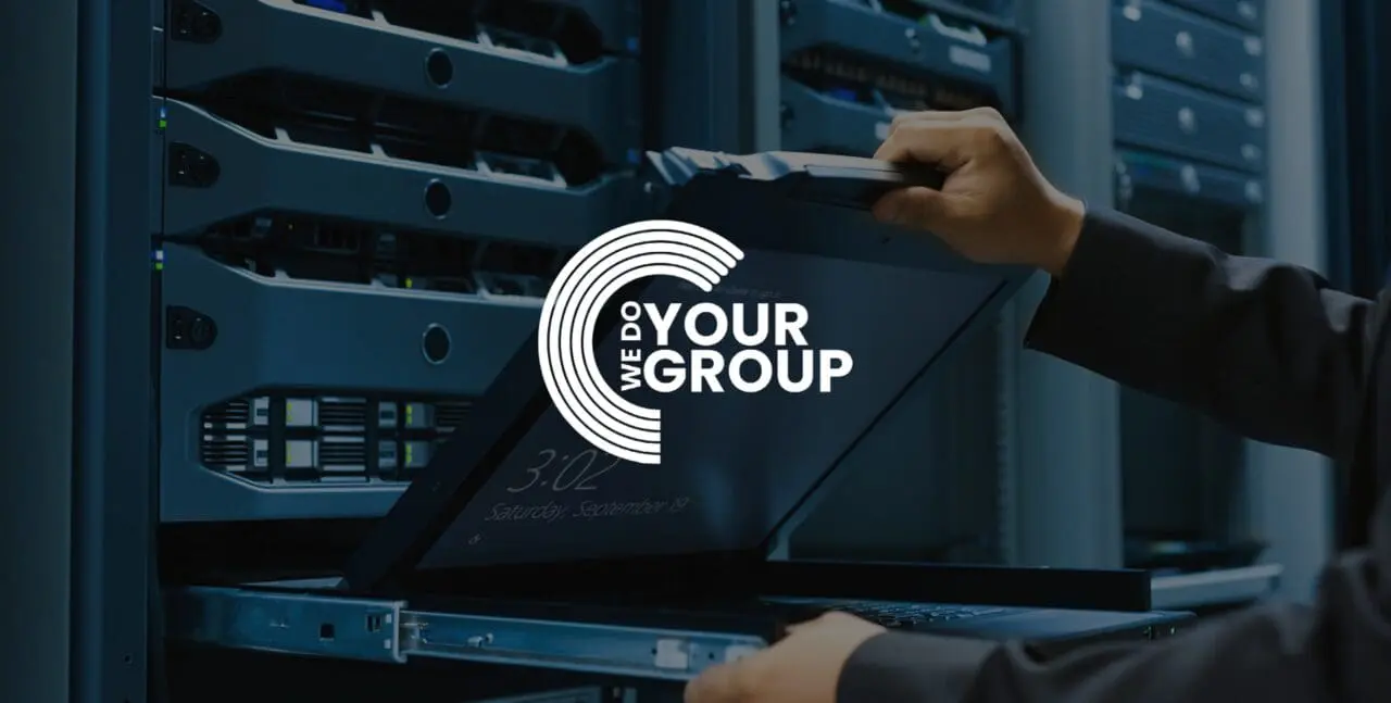 WeDoYourGroup white logo on background of man opening laptop stored in a drawer