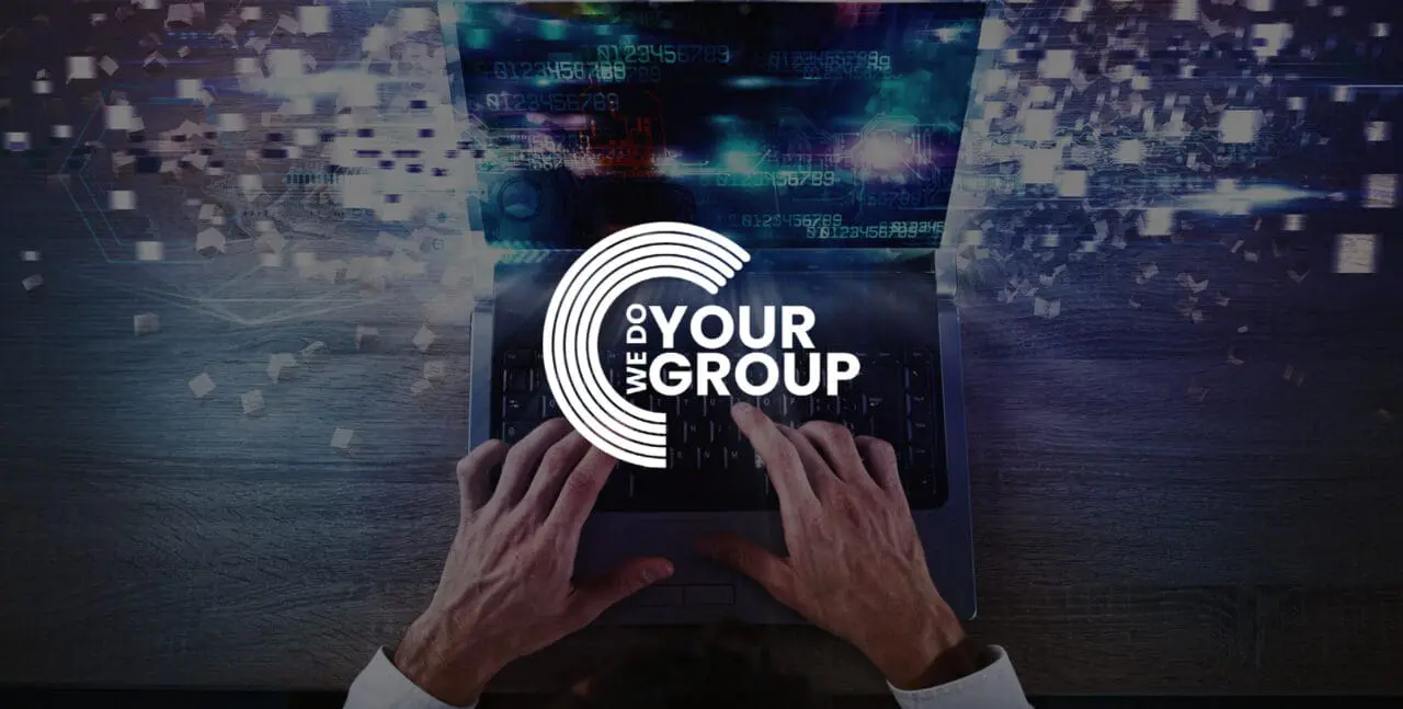 WeDoYourGroup white logo on background of tech development laptop