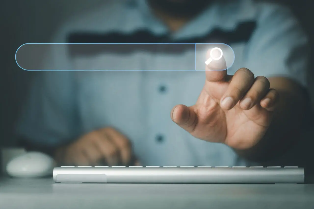 Search button on virtual screen pressed with finger. Businessman search data on internet finding information Website online.