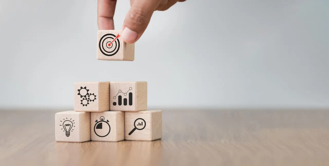 Benefits and challenges concept with wooden blocks