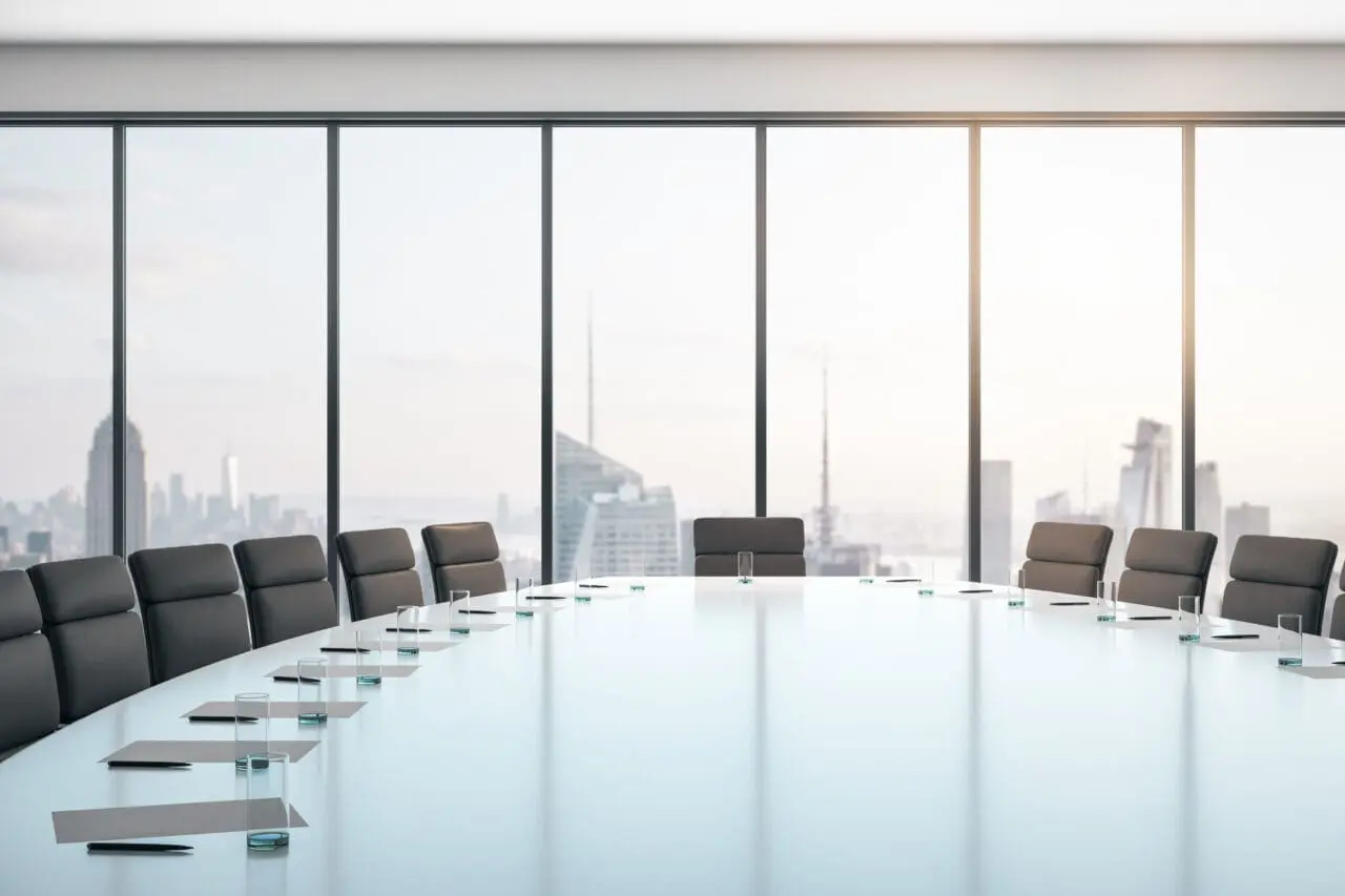 Conference room with table and chairs, large window and city view at sunrise, business concept. 3D Rendering