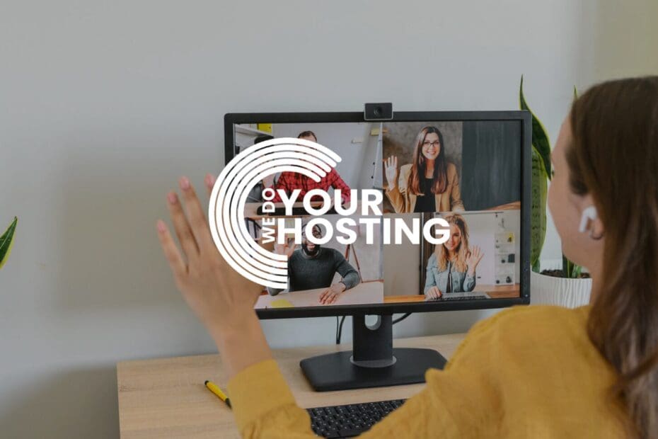 WeDoYourHosting white logo on background of woman at home, on a meeting video call with colleagues on her computer