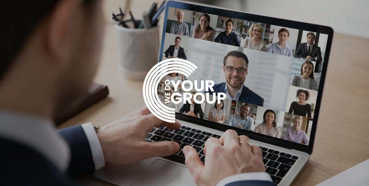 WeDoYourGroup white logo on background of man on conference calls on his Mac laptop