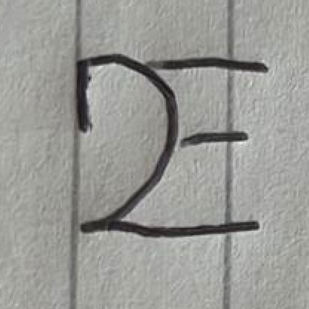 D2E Black logo Rebranding written on paper