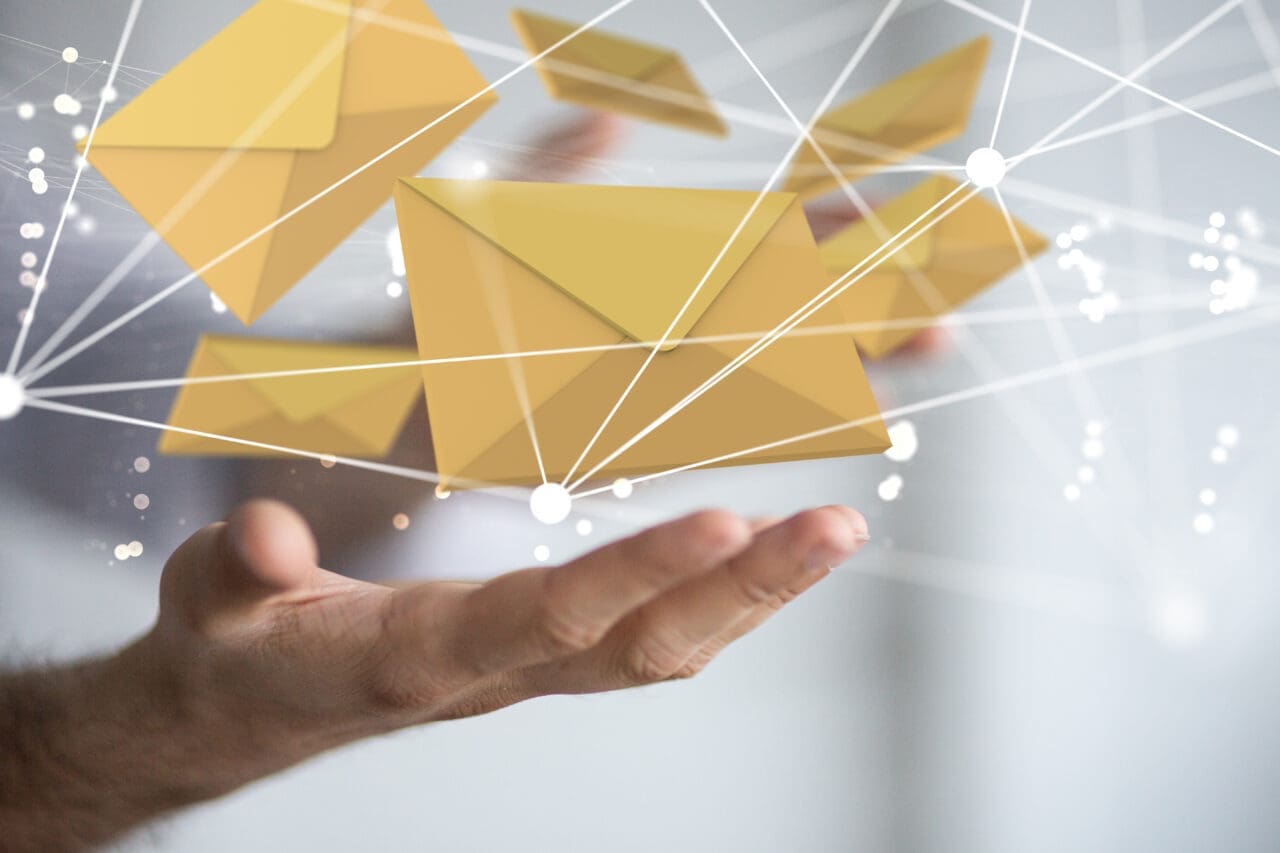 Hand with email envelope symbols digital