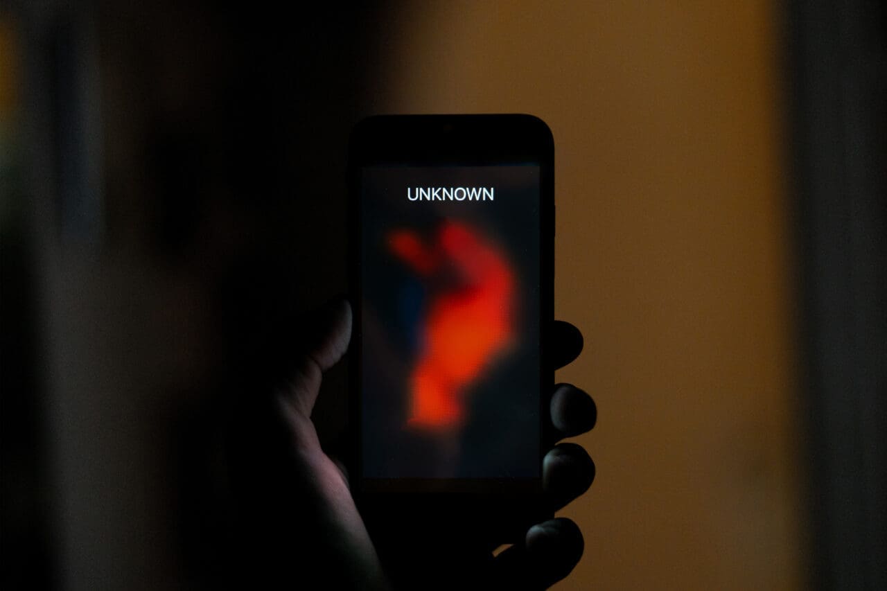 unknown anonymous person incoming phone call on mobile phone