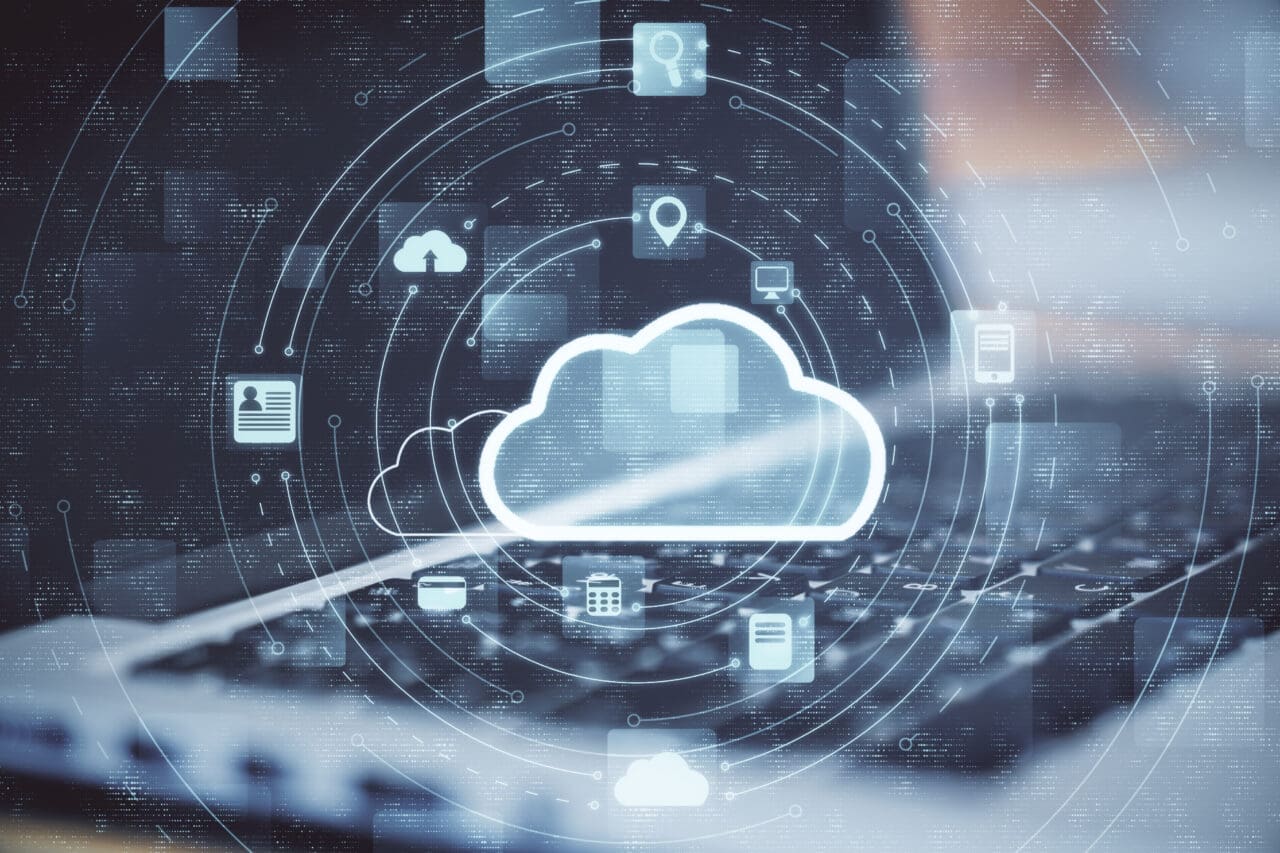 Cloud computing diagram with blurred keyboard in background