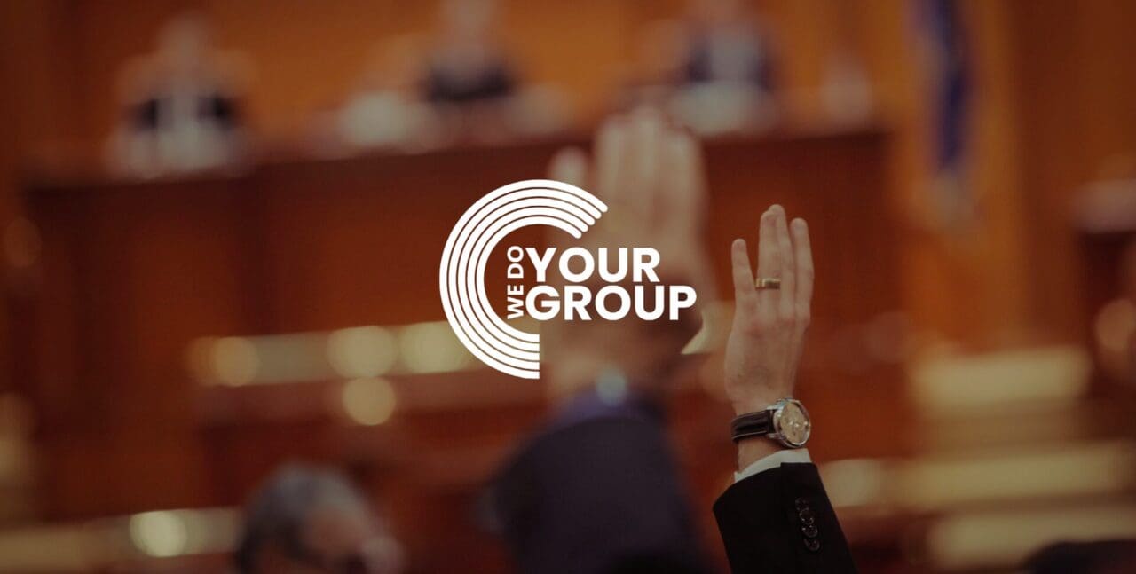 WeDoYourGroup white logo on background of man holding hand in air