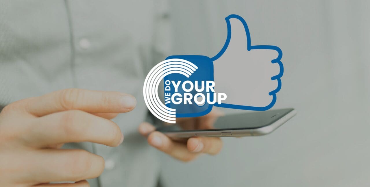 WeDoYourGroup white logo on background with mobile phone with digital facebook thumbs up logo