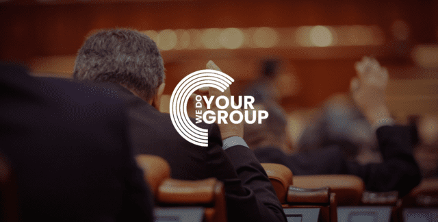 WeDoYourGroup white logo on background with room of business men