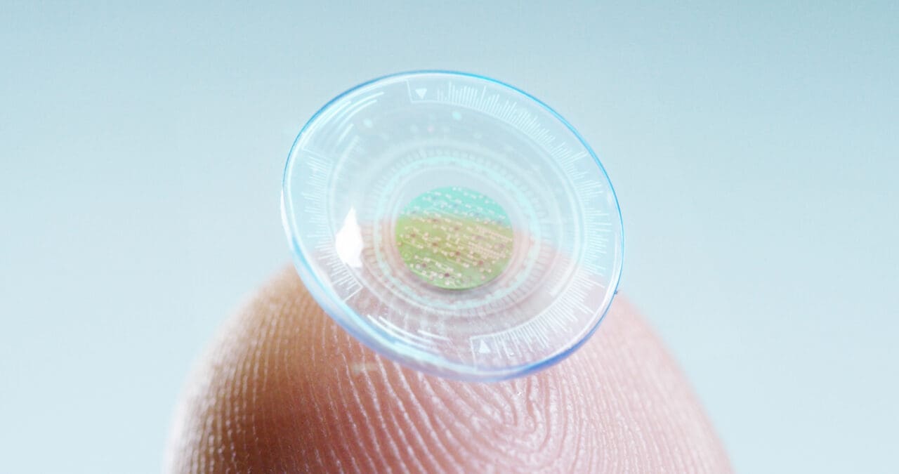 contact lens with digital and biometric implants to scan the ocu