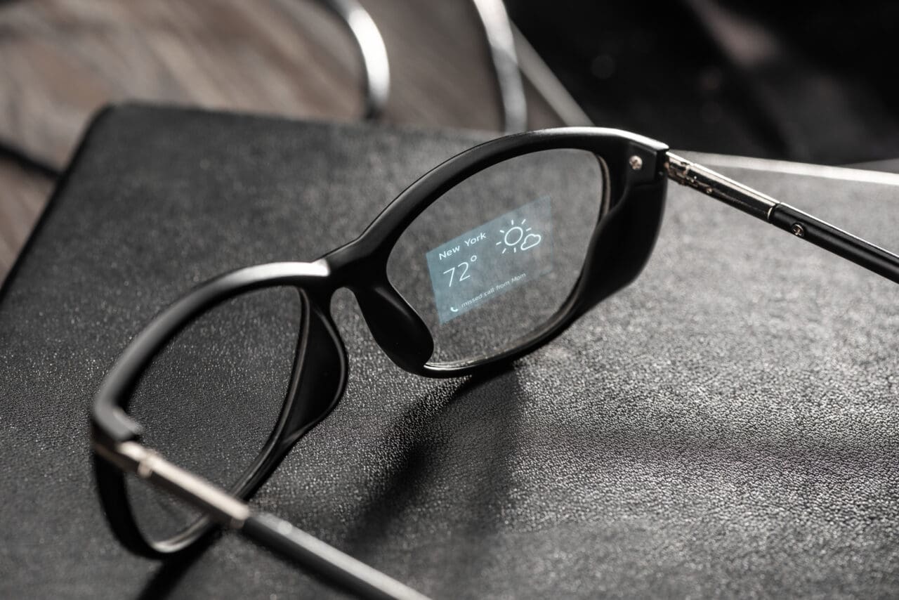 Weather app projected onto a lens of smart glasses. Relevant information right in front of your eyes. Augmented reality with holographic technology concept.