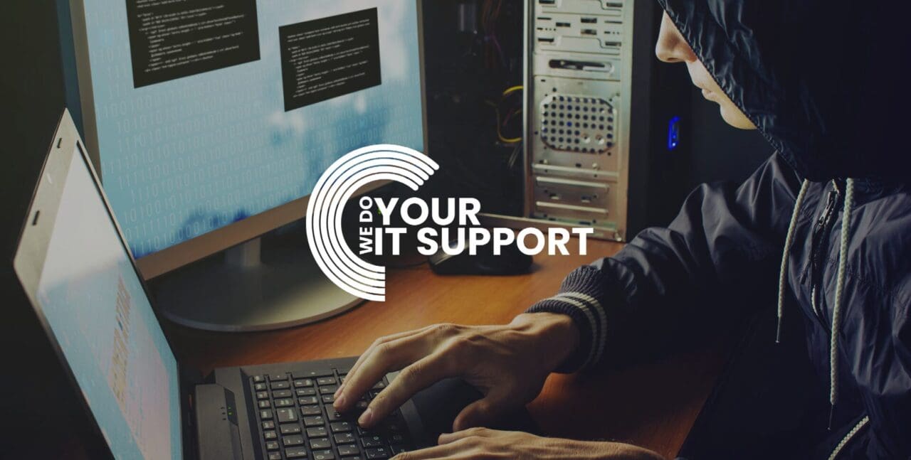 WeDoYourItSupport white logo on background with hooded man on a laptop