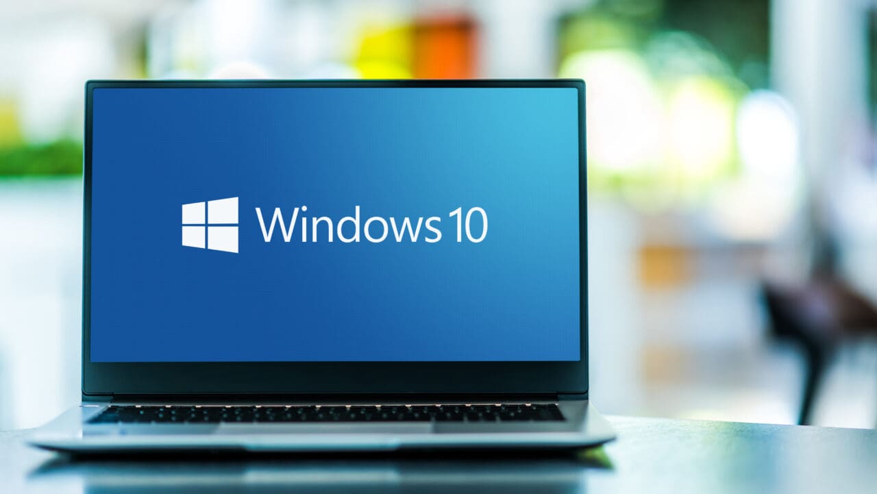 Laptop computer displaying logo of Windows 10 on screen