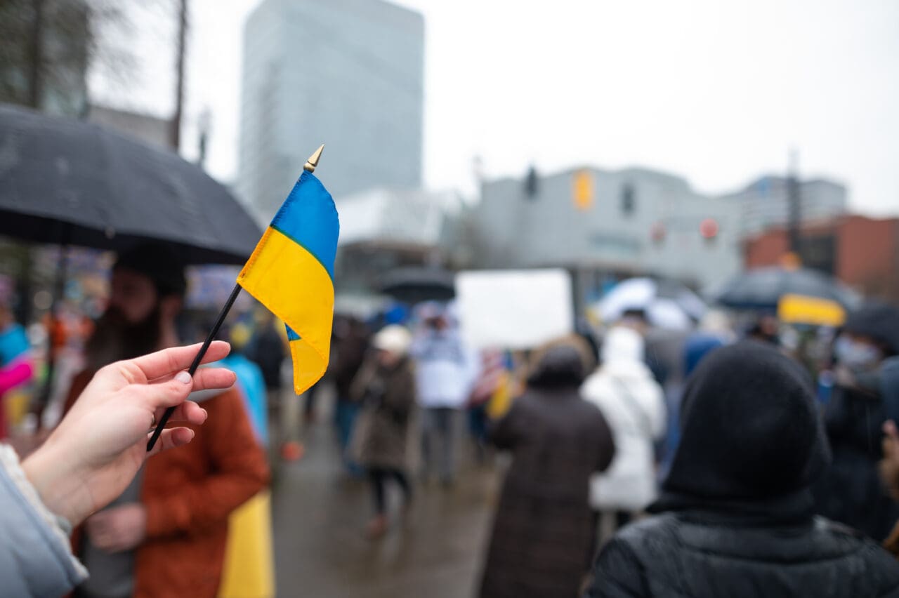 Ukrainian flag on the background of the rally. No war. Support for Ukraine