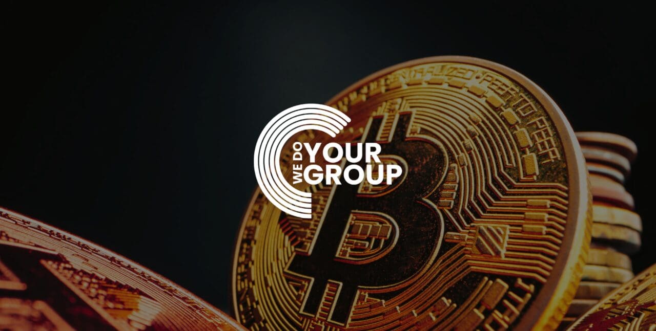 WeDoYourGroup white logo on background of Gold Bitcoins