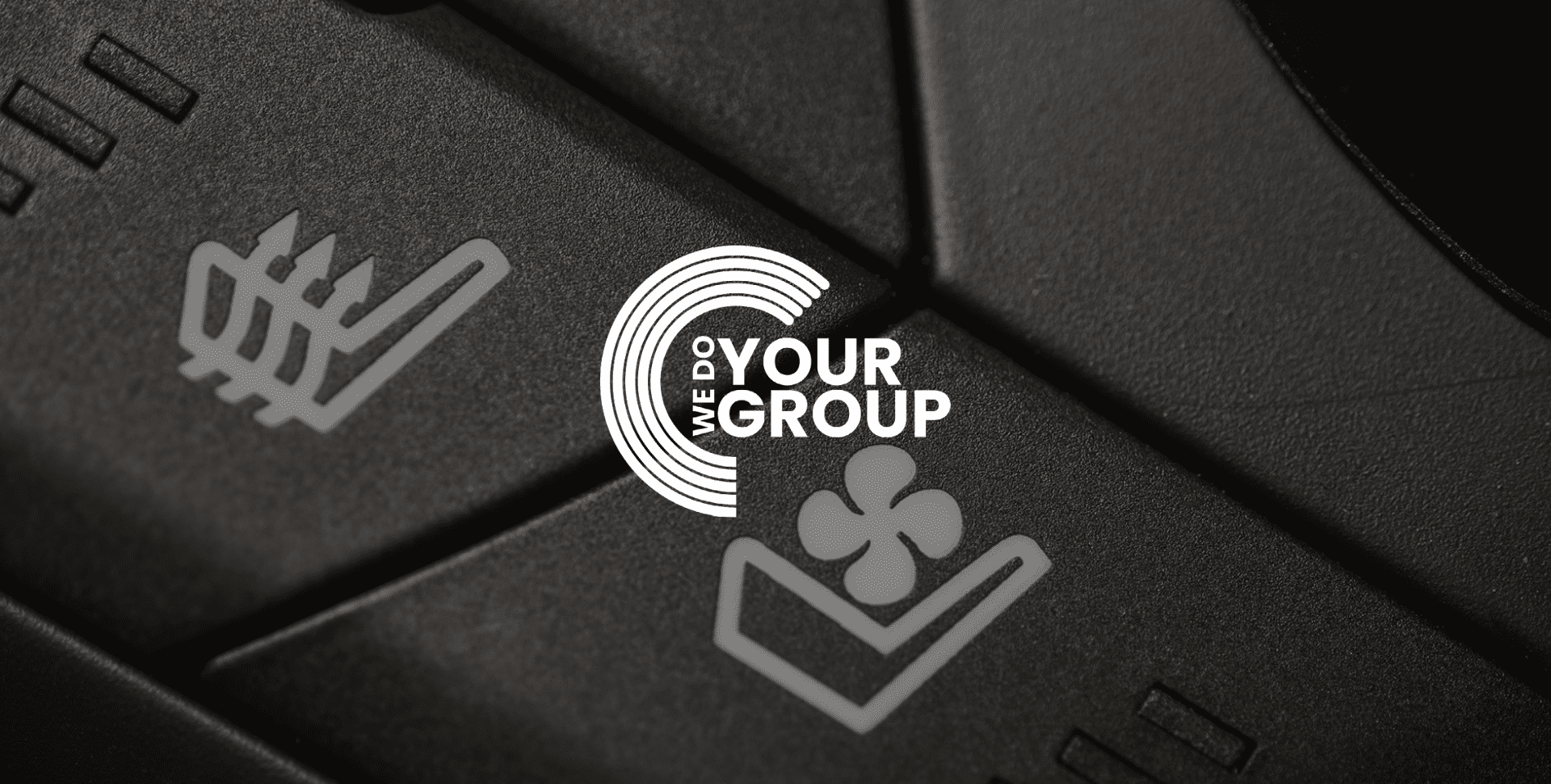 WeDoYourGroup white logo on background of heated seat buttons in car