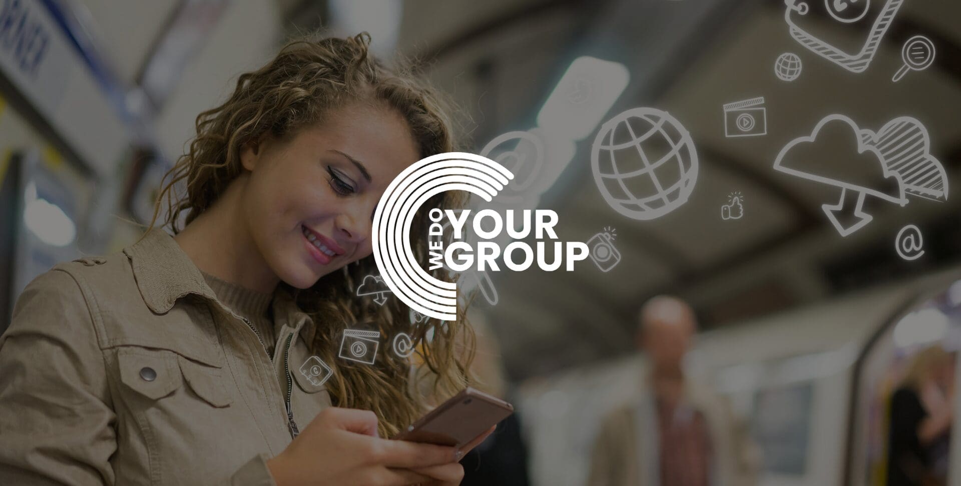 WeDoYourGroup white logo on background of young woman smiling at mobile phone