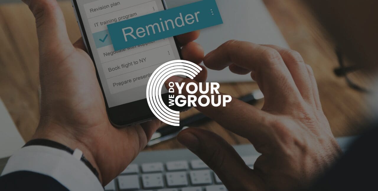 WeDoYourGroup white logo on background of man clicking on phone screen with a reminder pop up