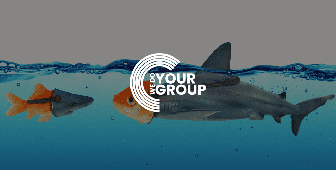 WeDoYourGroup white logo on background of gold fish wearing shark head and shark wearing gold fish head, both in water