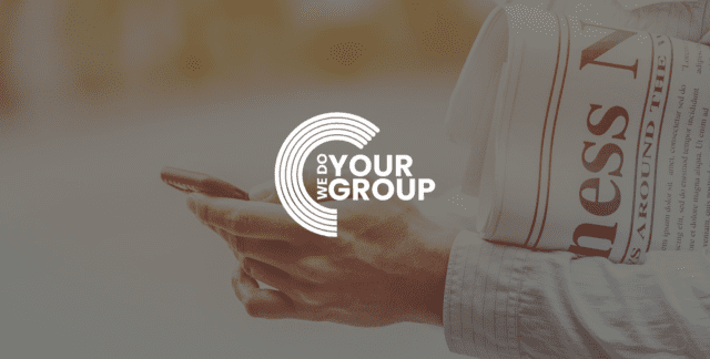 WeDoYourGroup white logo on background of man holding mobile phone with newspaper in his arm