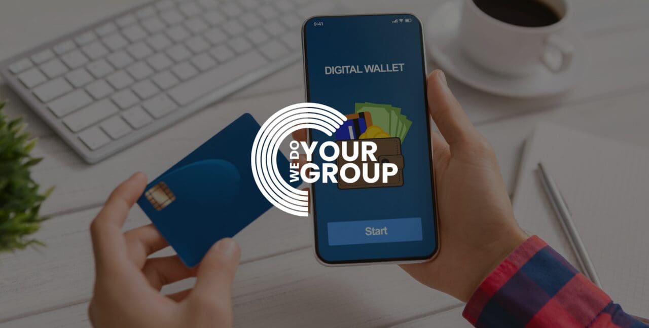 WeDoYourGroup white logo on background with mobile phone with digital wallet on screen. Man holding bank card next to the phone