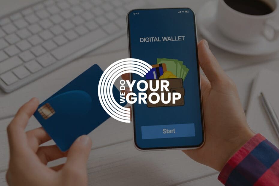 WeDoYourGroup white logo on background with mobile phone with digital wallet on screen. Man holding bank card next to the phone