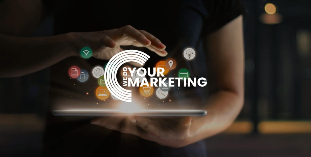 WeDoYourMarketing white logo on background with man holding iPad with edited logo's coming out of the screen
