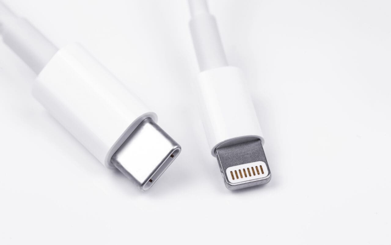 Apple Lightning to USB-C cable on the white background, macro.