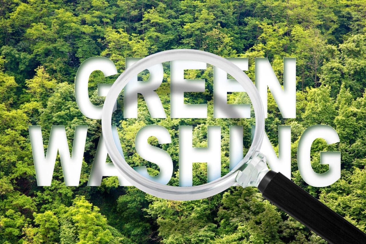 green washing text with magnifying glass over the top