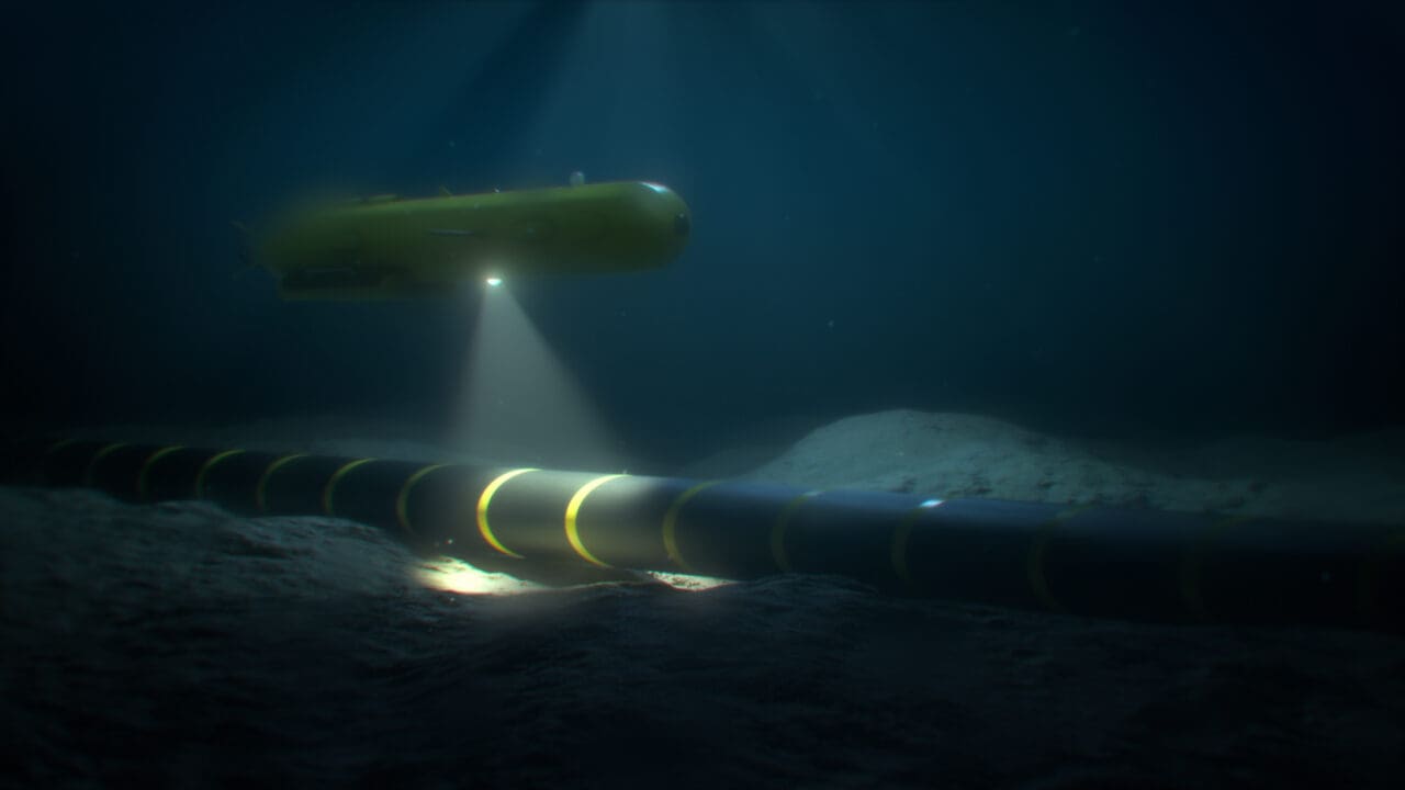Autonomous underwater vehicle (AUV) rover-drone inspecting a sub