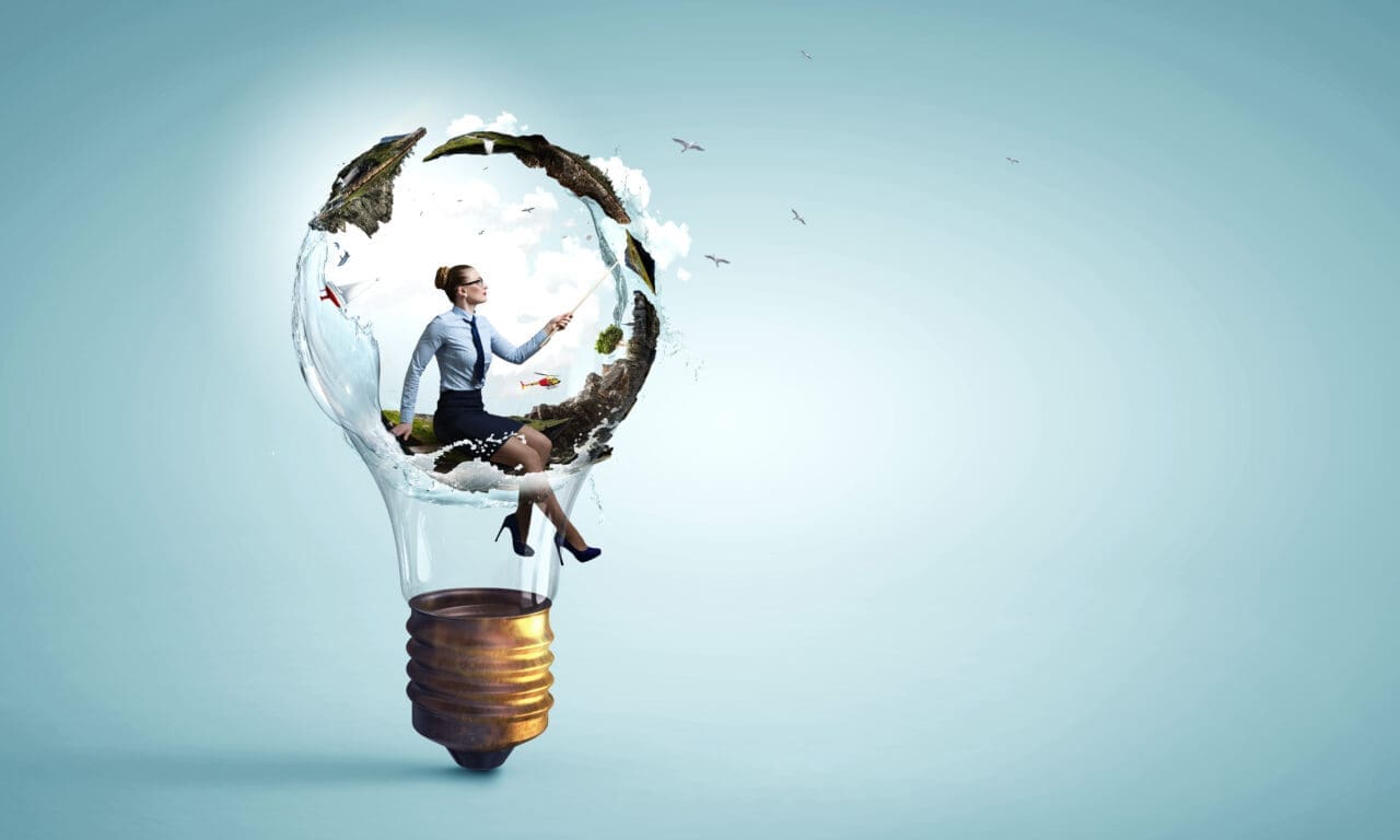 woman sat inside a light bulb with plants
