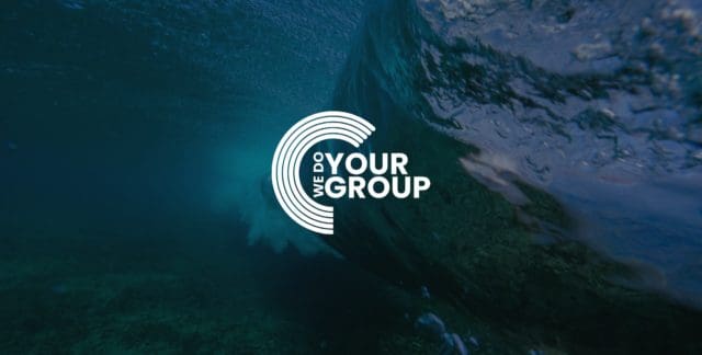 WeDoYourGroup white logo on background of the inside of an ocean wave
