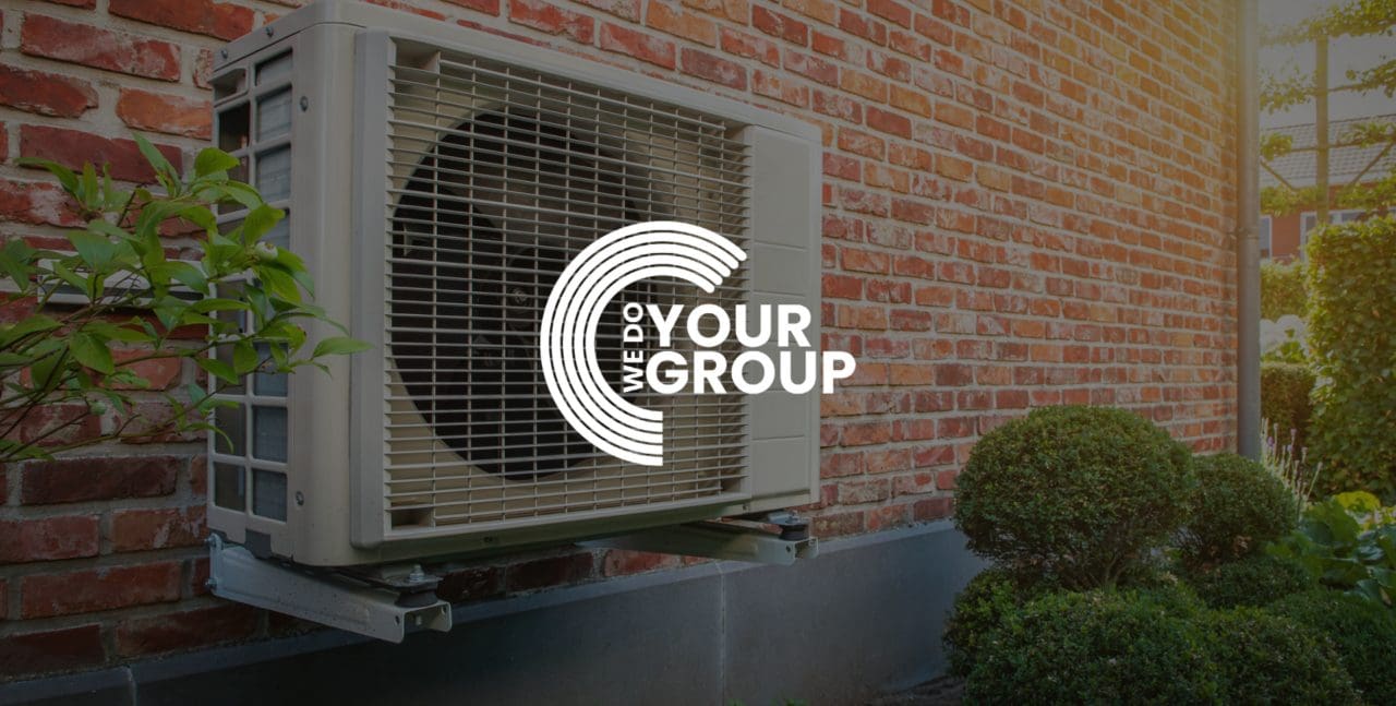 WeDoYourGroup white logo on background with heat pump on side of building