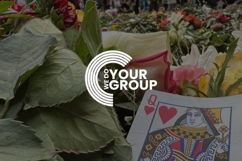 WeDoYOurGroup white logo on background with Queen playing card placed on flowers and leaves