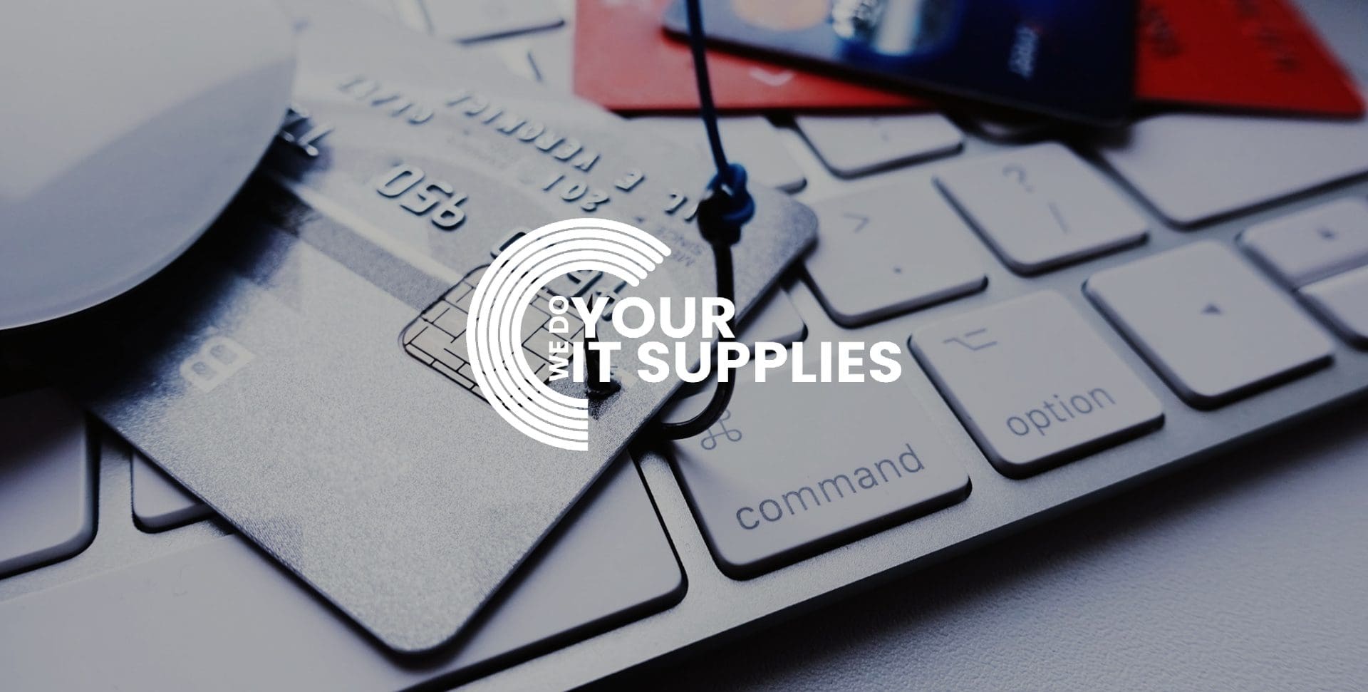 WeDoYourITSupplies white logo on background of Mac keyboard on desk, with bank card on top of it, with a hook through the card