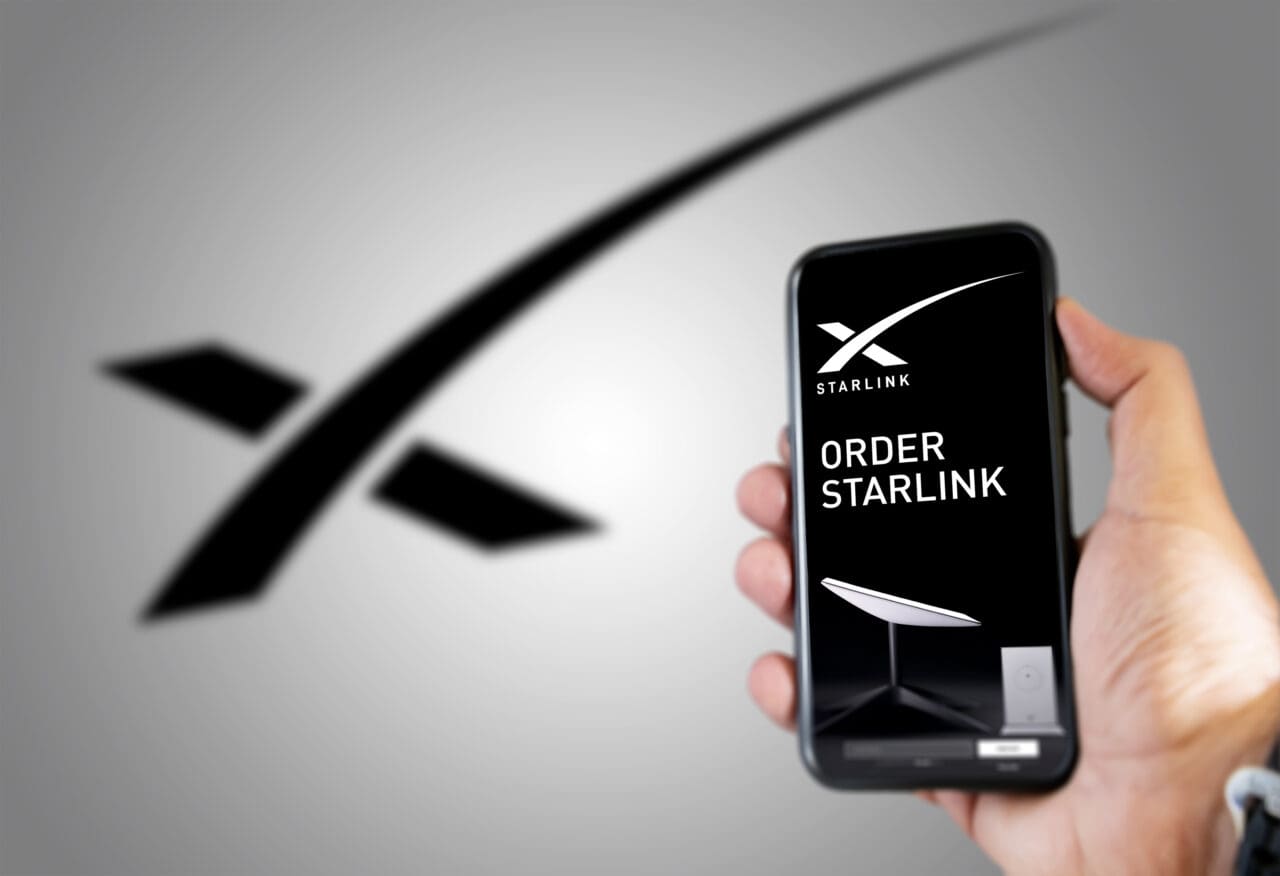 Someone ordering a Starlink product using a smart phone. Starlink (SpaceX) is a satellite communications system