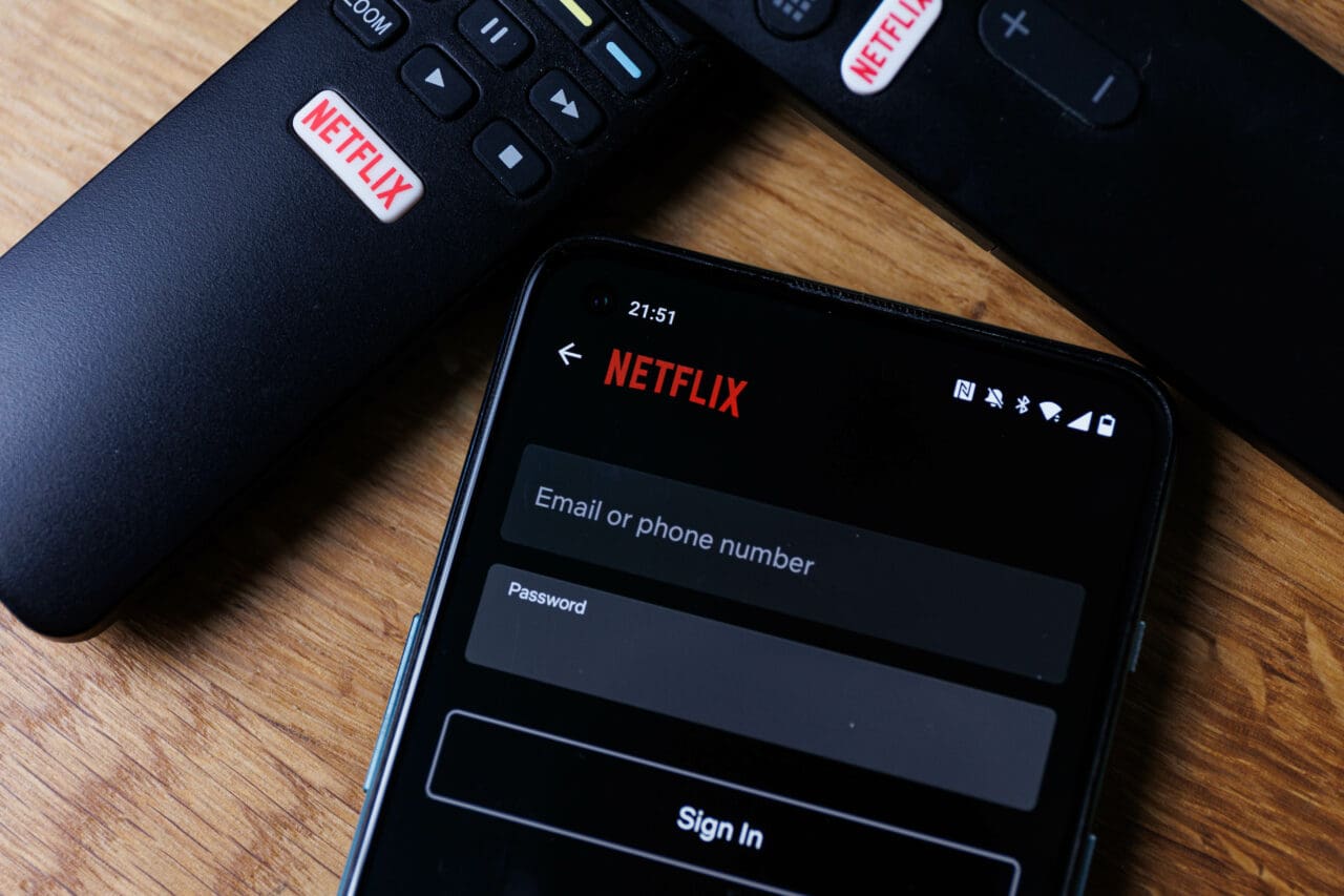 Netflix login on smartphone display. New password sharing rules on Netflix