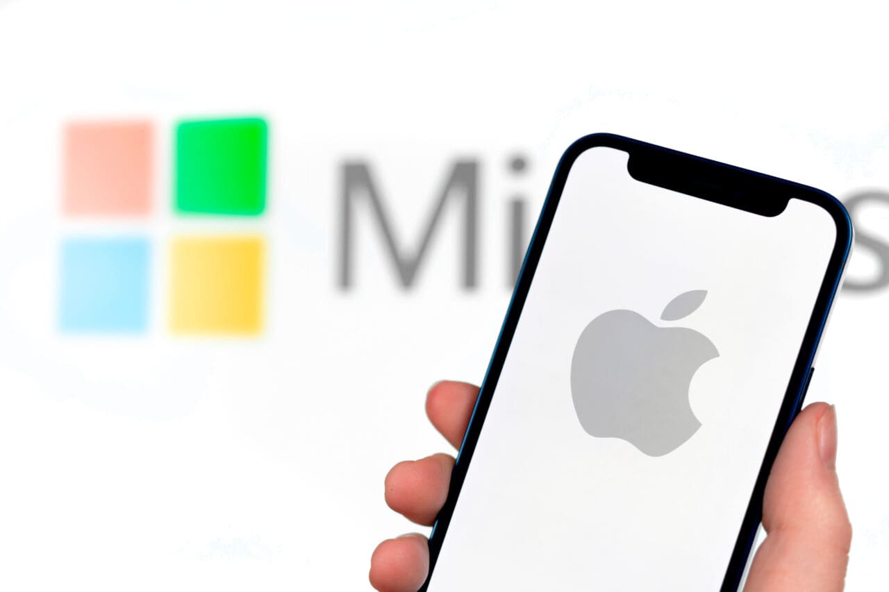 Apple vs microsoft concept. Mobile phone with logo on the screen, close-up view, business photo