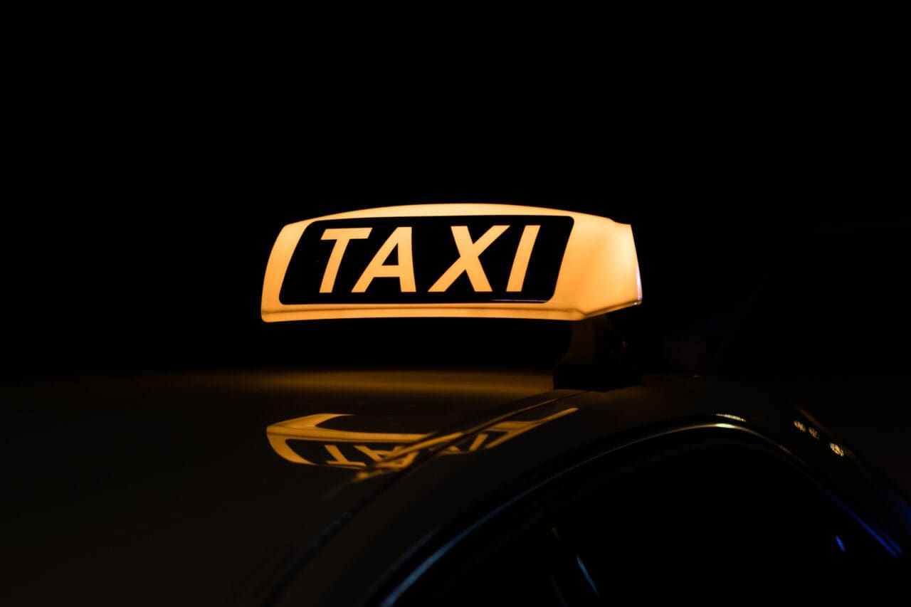 taxi sign illuminated - taxi sign at night
